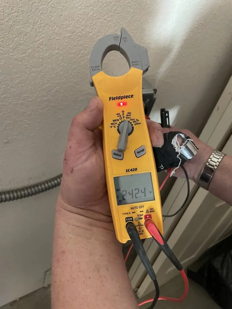 Voltage testing with clamp meter during Circuit Breaker Repair in Cottage Grove